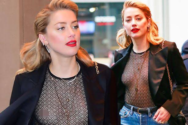 Amber Heard posted a picture on social media which raised some eyebrows. Pic courtesy: mirror.co.uk