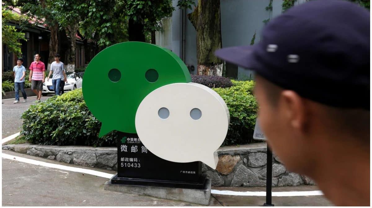 Boy staring at the WeChat logo