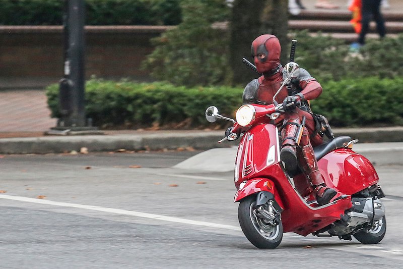 Deadpool on a pink scooter