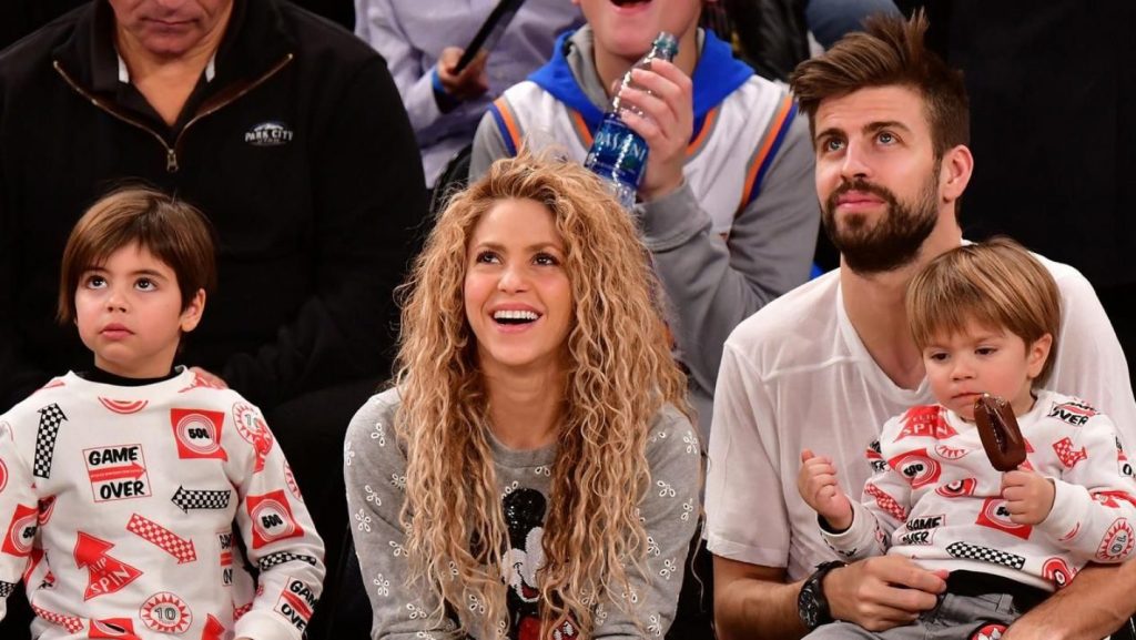 Shakira and Pique with their kids at a NBA game