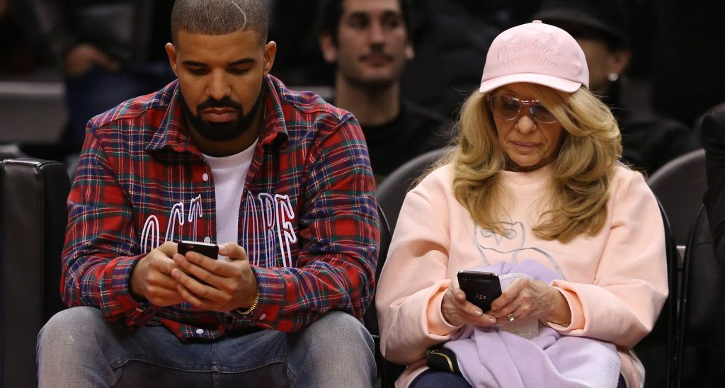 Drake beside his mother 