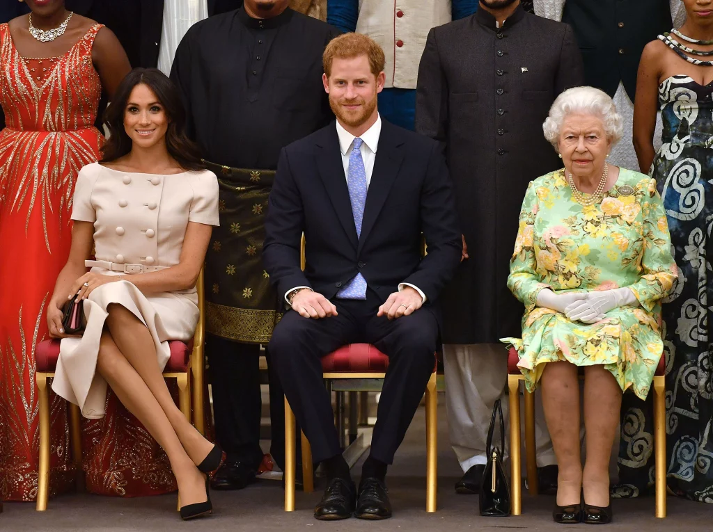Meghan Markle along with her husband Prince Harry and Late Queen Elizabeth II