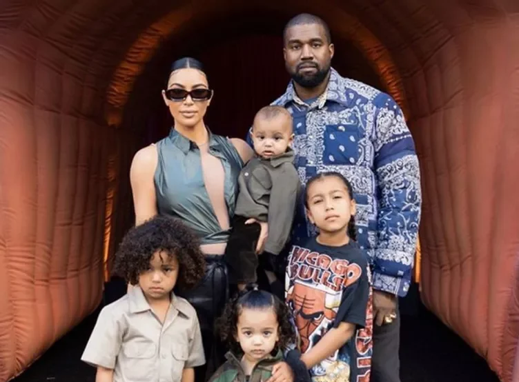 Kanye West and Kim Kardashian with their kids