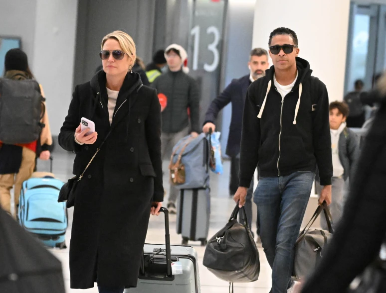 Amy Robach and T.J. Holmes at the New York Airport