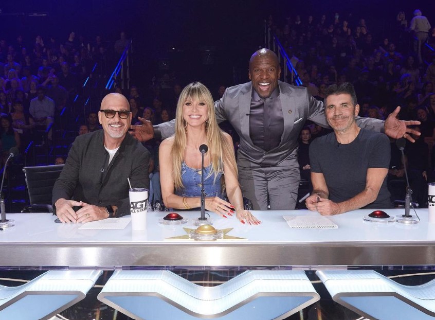 Simon Cowell with AGT's other judges and host