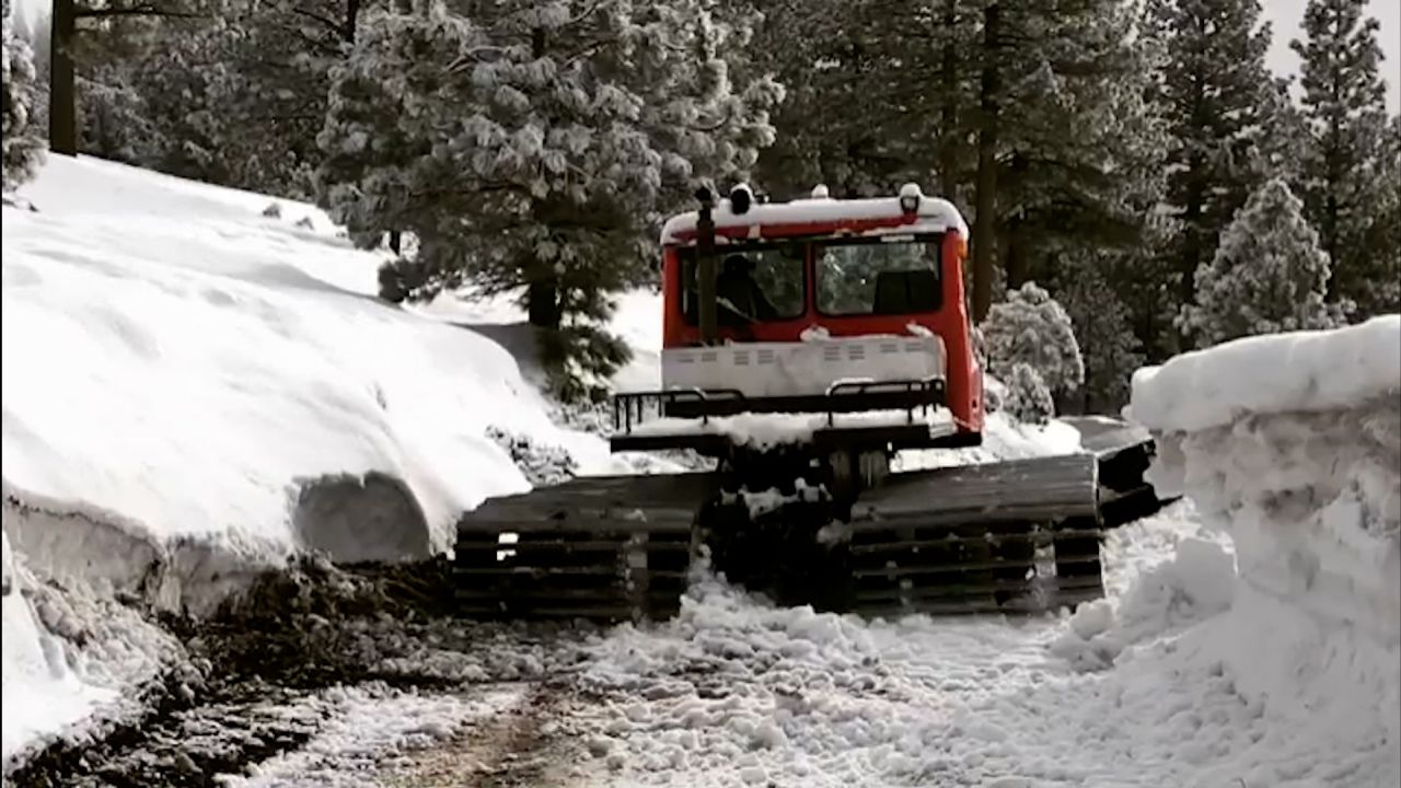 Jeremy Renner operating his snowmobile